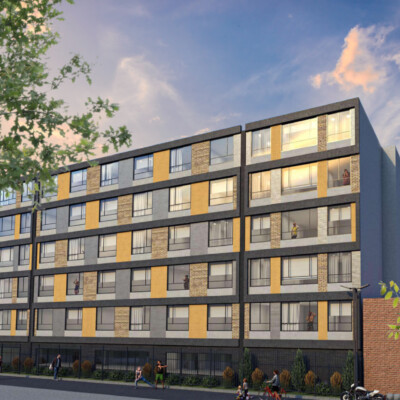 Fachada Principal del edificio, con ladrillo a la vista, ventanería, elementos en concreto y en pañete con pintura para fachadas, elementos de diferentes volumenes.